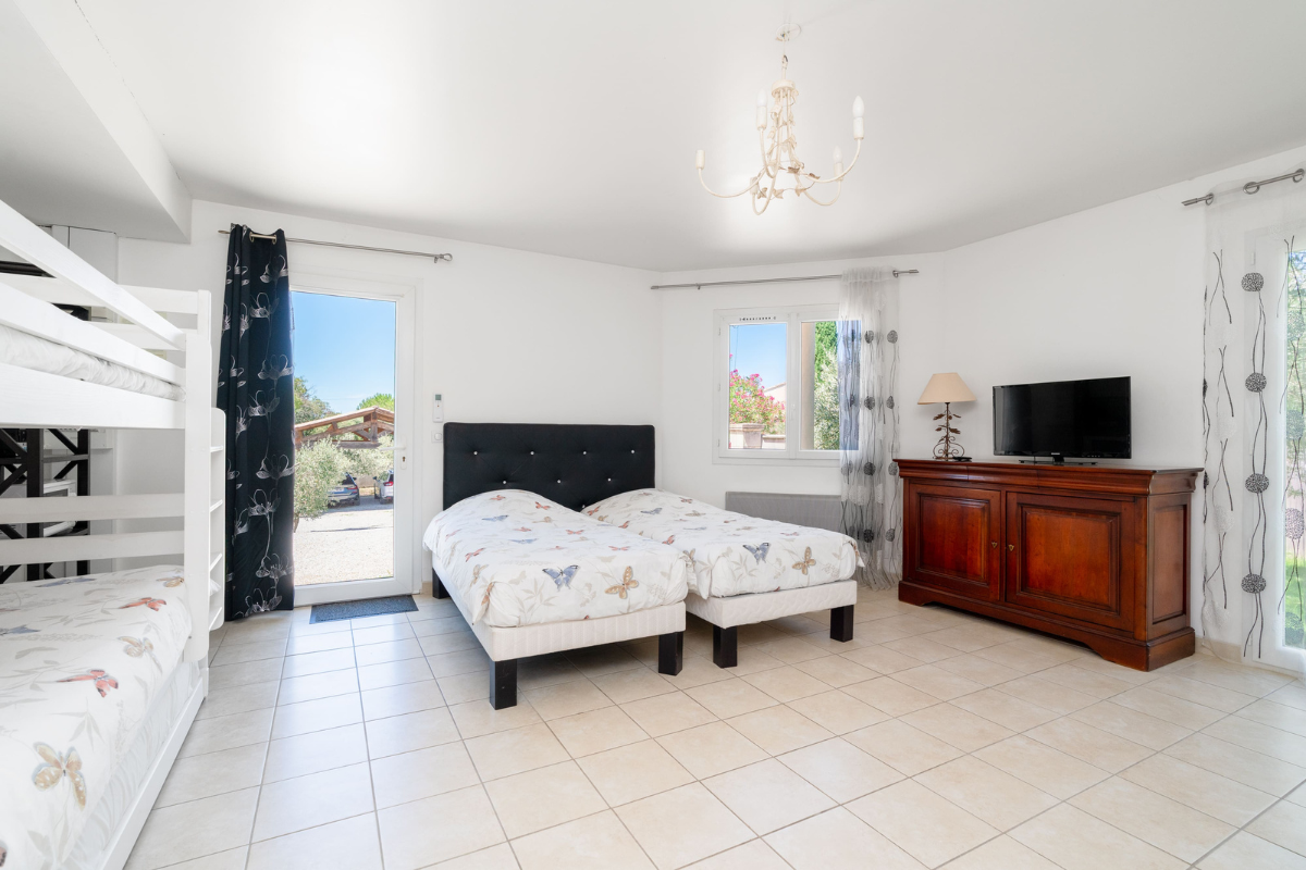 large bedroom with four beds