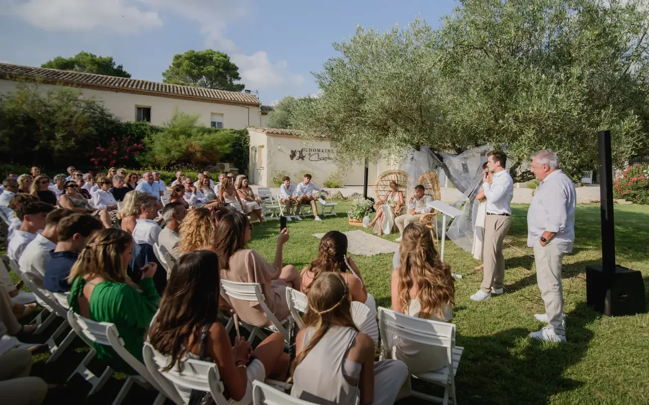 The bride and groom - their guests- during a secular ceremony in one of the outdoor areas